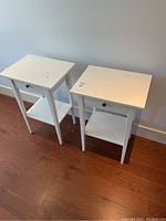 Two white side tables side by side, showing overall design with drawer and bottom shelf.