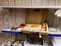 Fisher-Price record player with lid open, owners manuals and View-Master viewer with reels to the left