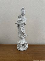 Front view of vintage Blanc de Chine porcelain statue showing full figure, robes, and base detailing.