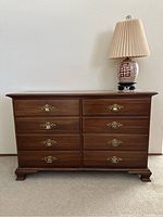 Front view of dresser with eight drawers and brass handles