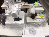 Front view showing both machines: Baby Lock serger (left) and Morse sewing machine head (right)