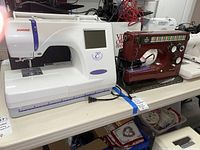 Overview of two sewing machines (Janome embroidery and Viking) side by side on table