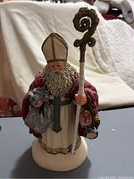 Full front view of the signed limited edition figurine showing detailed clothing and staff