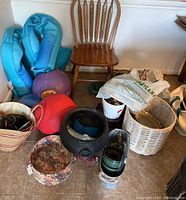 Photo showing the full lot including pool floats, exercise ball, baskets, planting pots, and a wooden chair (not included).
