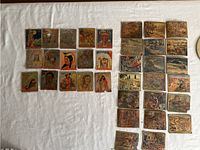 Overview of 34 vintage gum and cigar cards laid out on white cloth