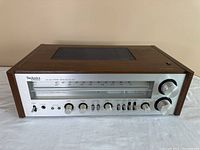 Front view of the vintage Technics SA-400 stereo receiver showing wood side panels and silver front panel with tuning dial and knobs.