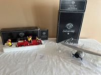 Warner Brothers 1937 Aheens-Fox fire truck with ducks and 1929 Lockheed Air Express stunt plane models with original boxes