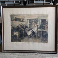Framed artwork titled "The Nervous Oyster," showing a man in an apron with seated gentlemen around him in a vintage rustic interior, under glass in wooden frame.