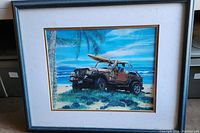 Framed artwork by Darshan Zenith showing Jeep parked on beach with surfboard and palm tree, landscape orientation.