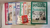 Eight back issues of Post Card Collector magazines with varied colorful covers and a Canadian province post card booklet with a red cover showing the Canadian coat of arms and provincial crests.