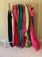 Ten dresses on rack showing full lot