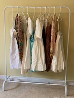 Full rack view showing dresses hung side by side