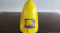 Yellow buoy-shaped boat safety kit container