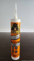 Front view of Gorilla Heavy Duty Construction Adhesive tube showing packaging details and gorilla logo.
