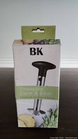 Front side of the BK Pineapple Corer & Slicer box showing product name and partial image.