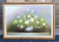 Full view of the framed oil painting showing the floral arrangement and framing details