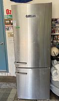 Front view of stainless steel refrigerator showing exterior finish and handle style