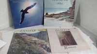 Four vinyl albums by Zamfir displayed together on a shelf, showing cover art including a bird in flight and a seashore scene.