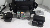 Full lot including Sony Handycam camcorder, Kodak Bantam F8 camera, Sony CD Walkman, two lenses, and carrying bag
