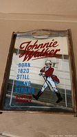 Full view of Johnnie Walker vintage serving tray with logo and branding on mirror surface inside wooden frame.