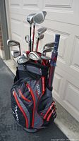 Full view of golf bag standing with clubs inserted