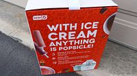 Box front showing product features and promotional text about making ice cream and popsicles.