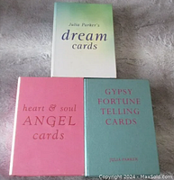 Three Julia Parker oracle card decks in their respective boxes: Dream Cards, Heart & Soul Angel Cards, Gypsy Fortune Telling Cards.
