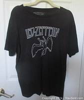 Full front view of black t-shirt with Led Zeppelin Swan Song logo graphic