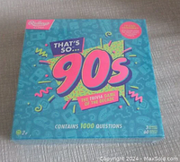 Front view of the sealed box showing the colorful 'That's So 90s' logo and indication of 1000 questions.