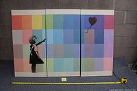 Three separate canvases laid out side by side against a brick wall showing Banksy's iconic girl reaching for a red heart balloon on a multicolored, pastel square background.
