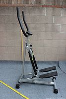 Stamina Spacemate folding stepper assembled, showing upright handlebars, foot pedals, and frame