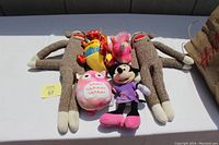 Photo showing all six stuffed animals arranged on a flat surface, highlighting condition and variety.