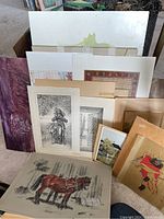 Assorted framed and unframed vintage artworks including sketches and prints, largest about 16 x 24 inches