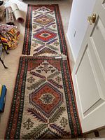 Full length view of runner showing geometric medallion pattern