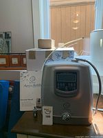 System unit, manual, hoses on table under window