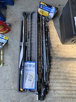 Photo showing the Micro Adjusting Torque Wrench in a gray plastic protective case, alongside the original packaging for the extension bars.