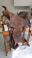 Full view of Big Horn saddle mounted on wooden stand