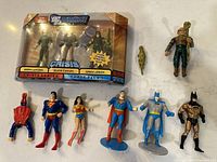 DC Universe Infinite Heroes boxed Crisis Series Three-Pack 5 including Green Lantern, Black Canary, and Green Arrow with loose vintage-style DC superhero figures and two Star Trek figures on white background.