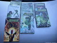Seven Green Lantern graphic novels displayed together showing front covers