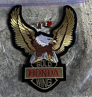 Full patch with the eagle and Honda Gold Wing text along with the three pins on a plastic bag