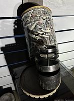 Programmable hanging deer feeder with camouflage pattern showing front view including Moultrie branding.