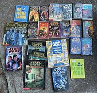 All Star Wars books laid out horizontally on the floor showing covers and titles clearly visible.