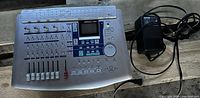 Full view of Tascam 788 mobile studio mixing board with power adapter.