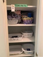 Full shelf with Marrakech bowl in box and five Corning Ware baking dishes with floral designs