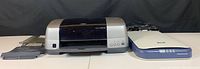 Side view of Epson Stylus Photo 900 printer and Epson Perfection 1250 scanner showing basic device shape and color