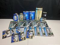 Full view of all packaged light instruments arranged on a white surface with black background.