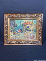 Framed paint on board artwork showing the full ornate frame and the landscape painting inside.