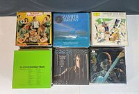 Top view of six vinyl records showing front covers with various artists and album titles.