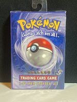 Front of sealed starter set box showing Poké Ball artwork and trading card game title
