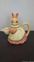 Front view of the bunny shaped ceramic teapot showing the detailed bunny face and dress design.